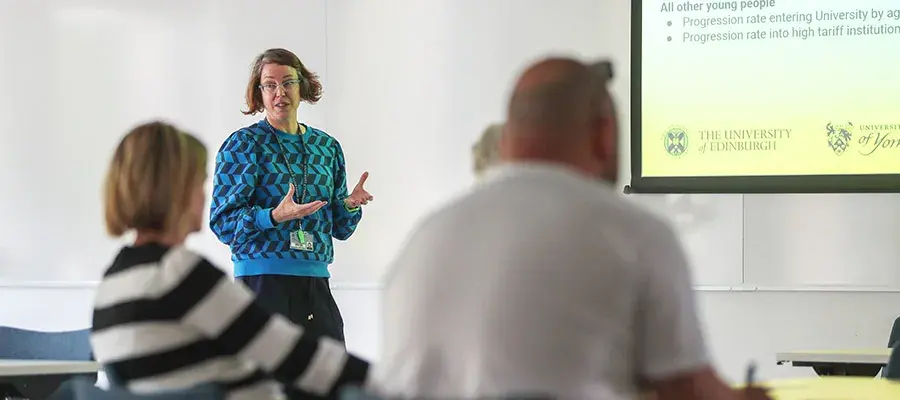 Recruitment staff delivering a presentation within a classroom
